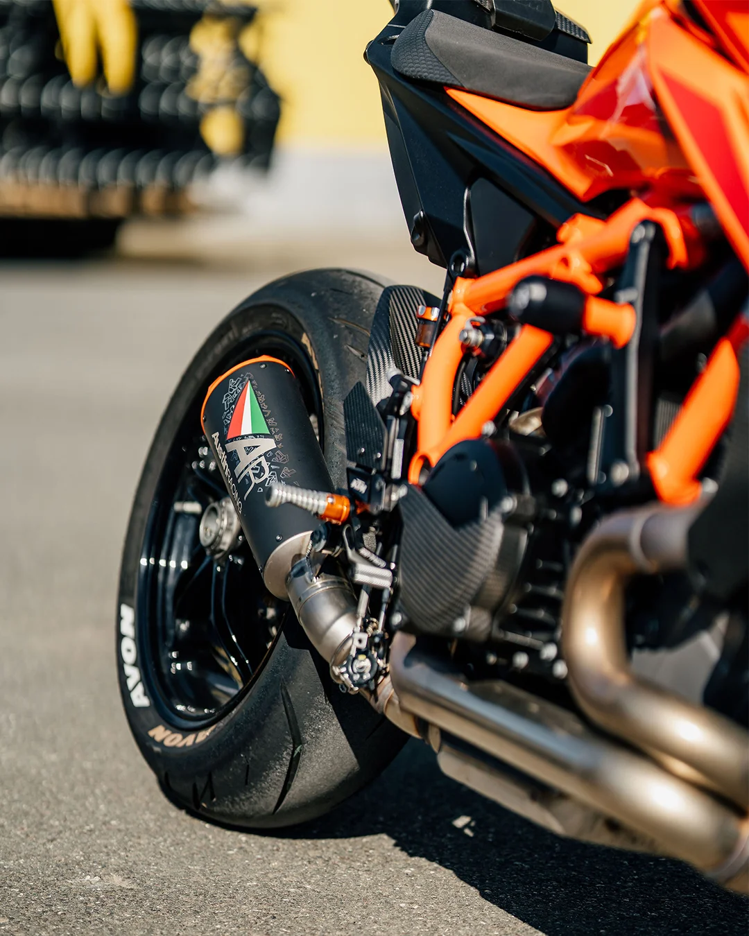 Close-up of a KTM motorcycle with Austin Racing exhaust system and Avon tires.